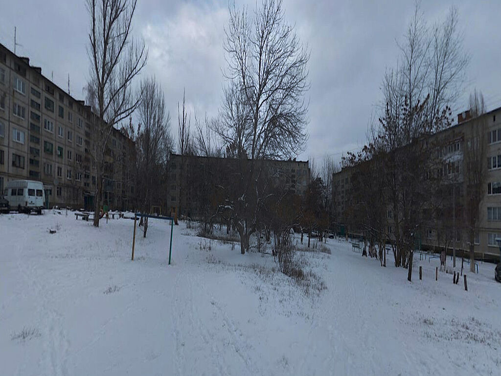 View of the multi-storey residential complex from the football field