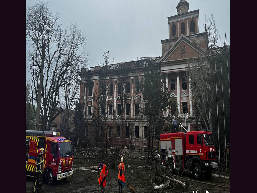 Rescuers work at the site