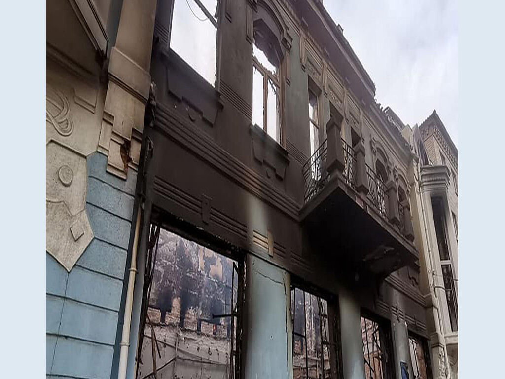 The building burned down after shelling