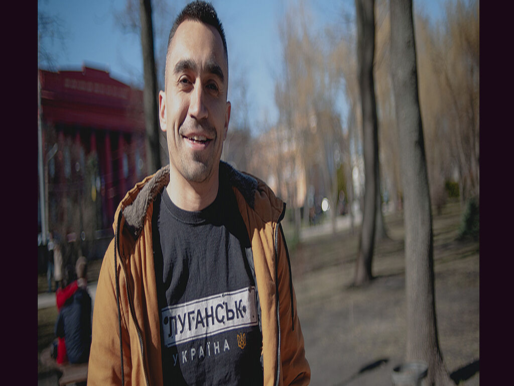 Luhansk is Ukraine. This is what is written on Oleksandr's sweatshirt (his hometown, temporarily occupied by the Russian Federation)