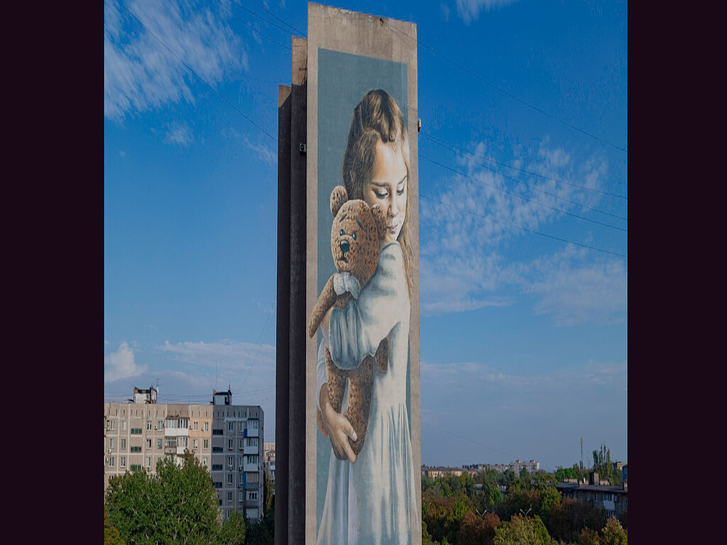 Mural "Milana" on one of the apartment houses in the city