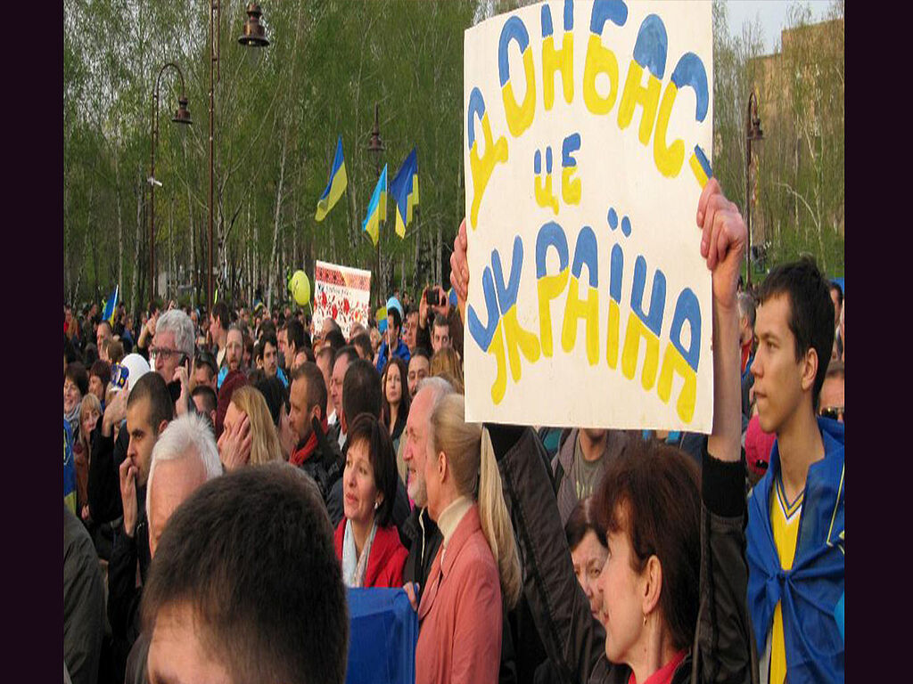 On the poster: "Donbass (Donetsk and Lugansk regions) is Ukraine"