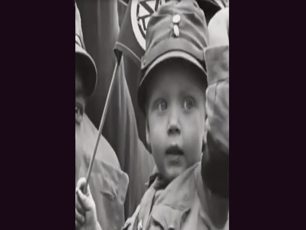 A child with Nazi symbols