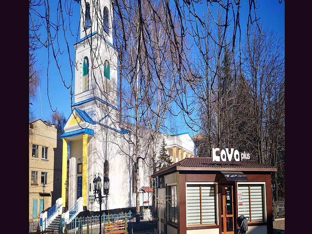 The construction of St Nicholas Church began in 1907, and on Easter 1909, its bells rang and the first service was held. But in 1936, the church was closed because the Soviet government began to impose a policy of state atheism. The Komsomol members, representatives of the Communist Youth Union, removed two domes from the church, smashed the bells, and burned church items and books. Until 1941, it was a grain warehouse and a stable.