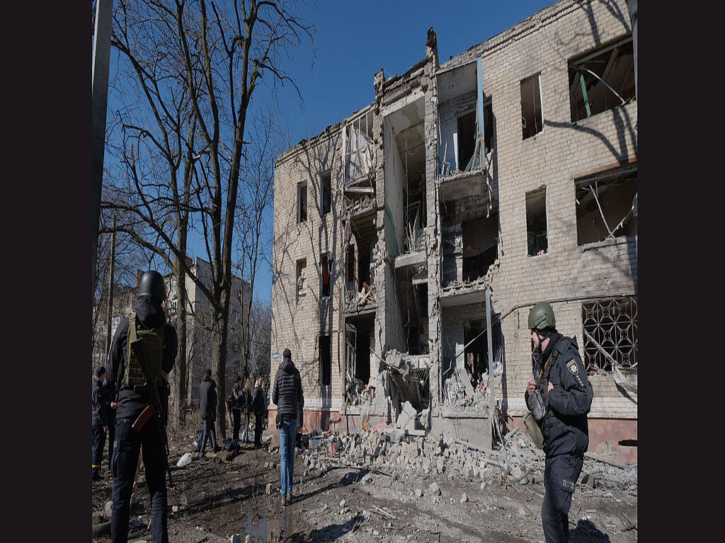 Residential house with people under the debris